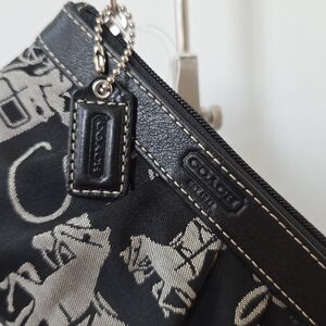 Coach Y2K Horse & Carriage canvas & leather wristlet in black.